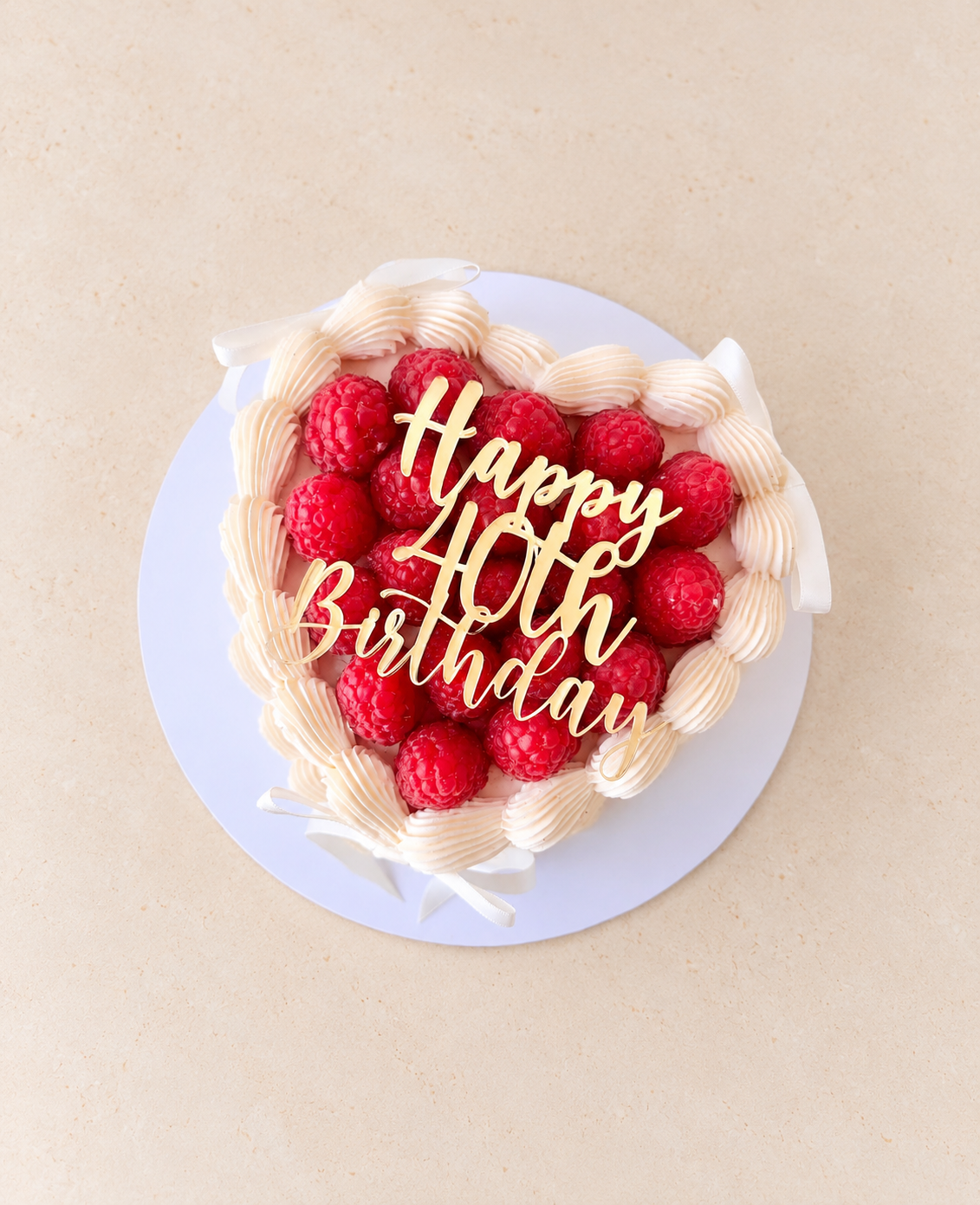 Raspberry topped heart cake