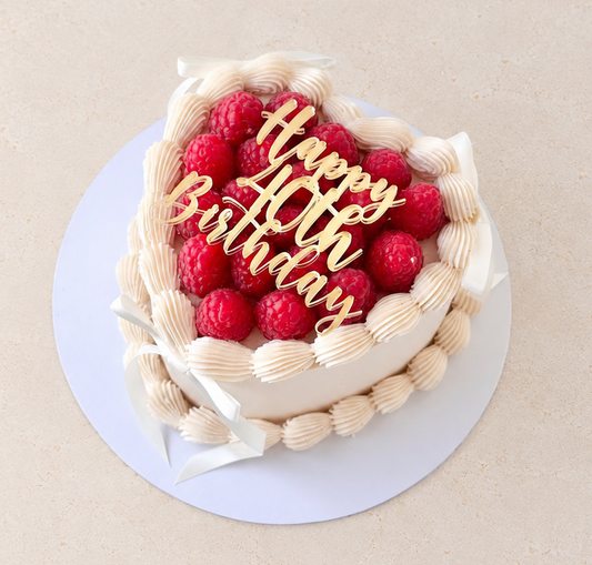 Raspberry topped heart cake