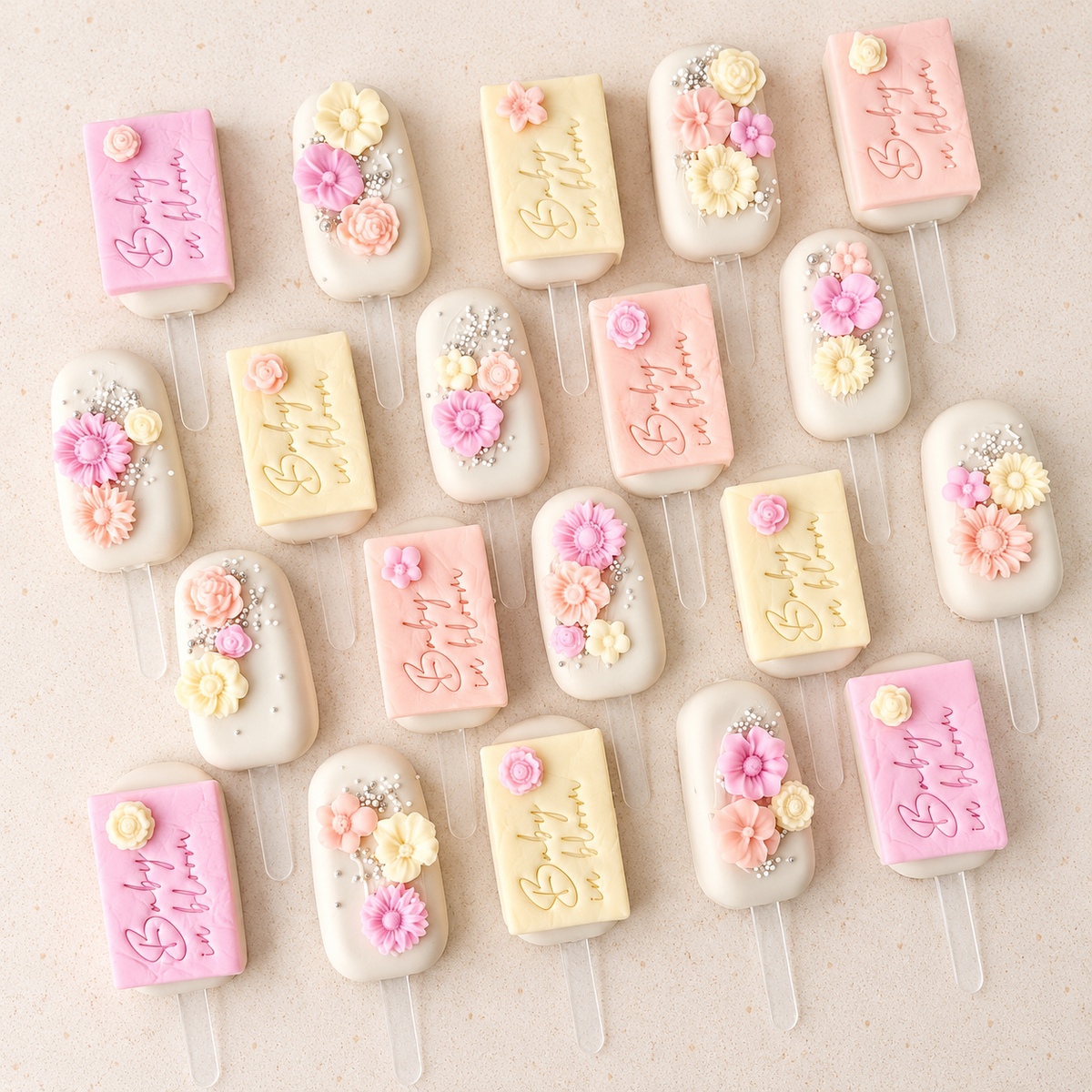 Baby in bloom themed cakesicles